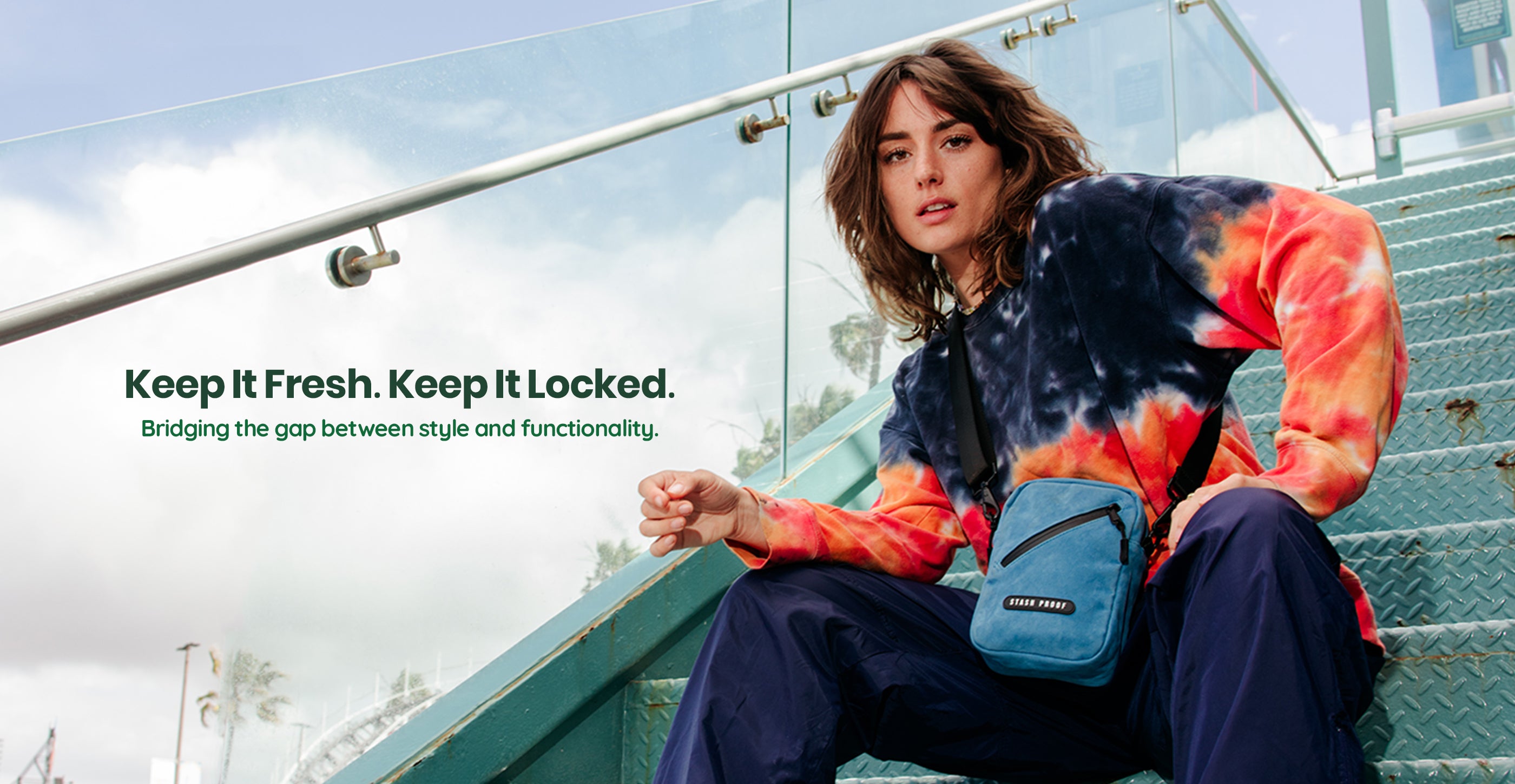Woman sitting on stairs with Stash bag, reads Keep it Fresh. Keep it Locked.